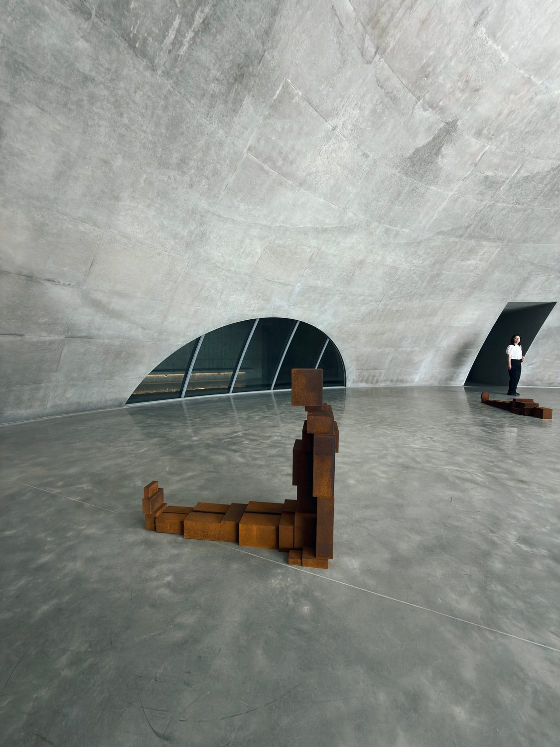 A Gormley figure in a concrete drum